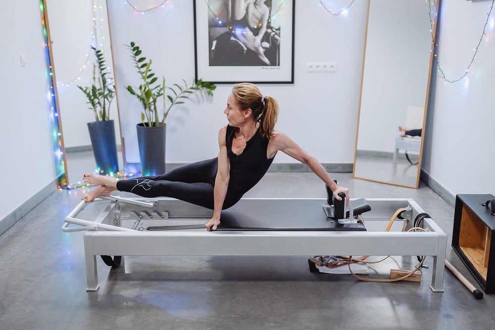 Classical Pilates side split on the reformer